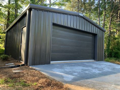 metal houses with garge door windows|metal buildings near me.